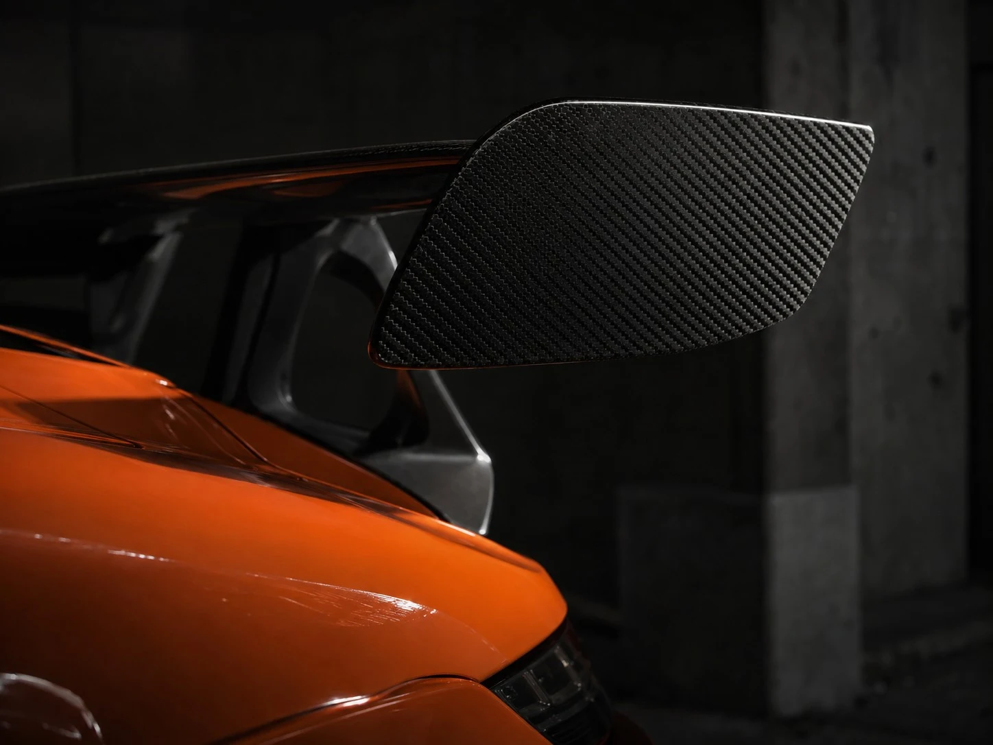 Close-up of paint and carbon-fiber details on an exotic car
